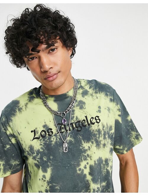 ASOS DESIGN relaxed t-shirt in washed black & yellow tie dye