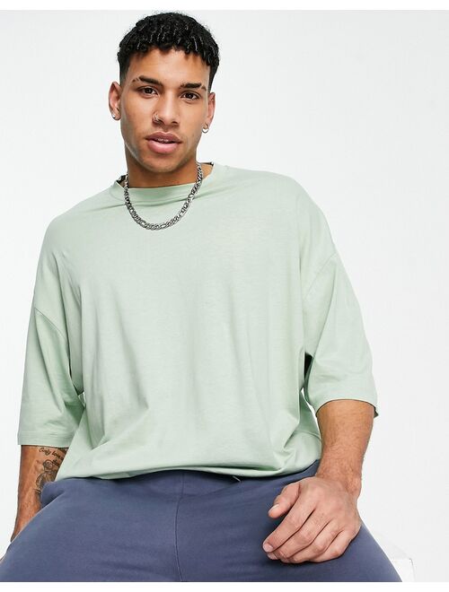 ASOS DESIGN oversized T-shirt in light green with souvenir back print