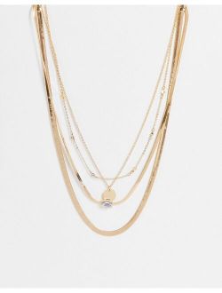 multi row necklace with crystal design in gold tone