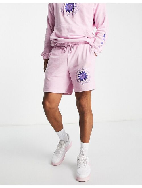 ASOS DESIGN relaxed terrycloth shorts with embroidery detail in pink