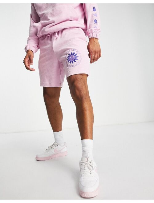 ASOS DESIGN relaxed terrycloth shorts with embroidery detail in pink