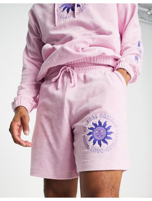 ASOS DESIGN relaxed terrycloth shorts with embroidery detail in pink