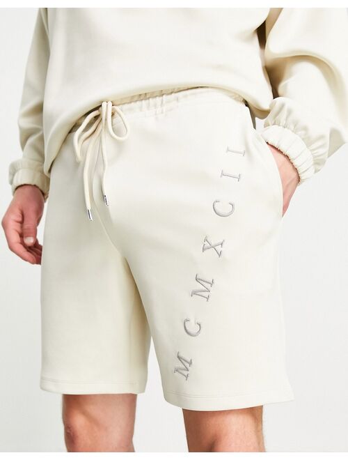 ASOS DESIGN set oversized scuba shorts with Roman numerals embroidery