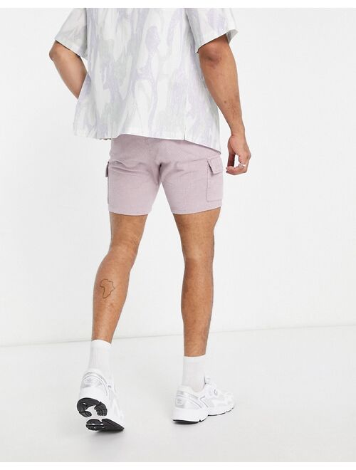 ASOS DESIGN slim cord shorts with cargo pockets in acid wash purple