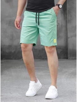 Men Letter Patched Drawstring Waist Shorts