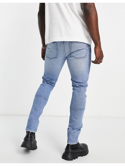 ASOS DESIGN skinny jeans in mid wash with knee zip moto detail