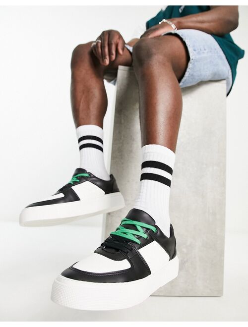 ASOS DESIGN faux leather retro sneakers in black/white