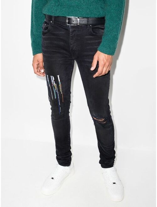 AMIRI logo-embroidered skinny jeans