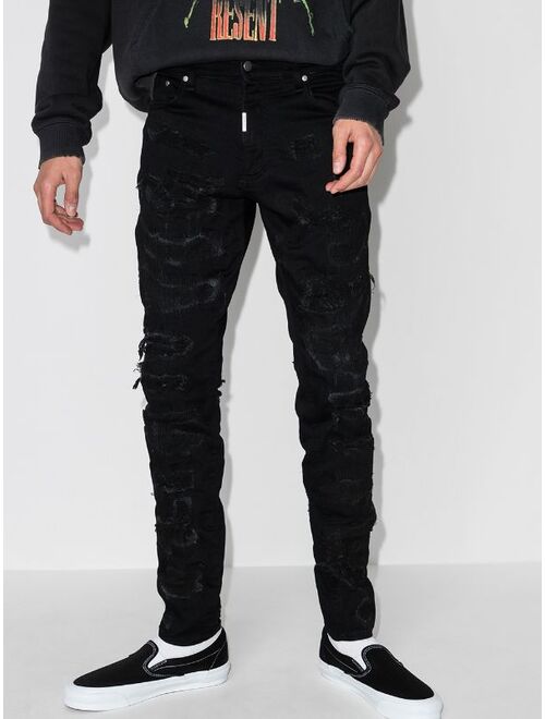 Represent ripped distressed skinny jeans