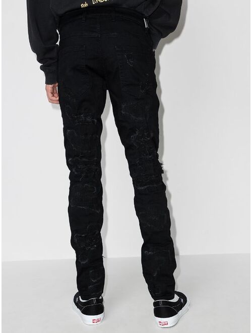 Represent ripped distressed skinny jeans