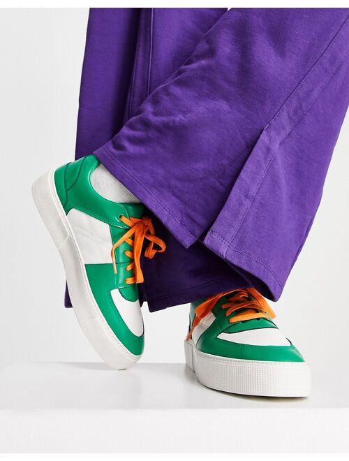 ASOS DESIGN faux leather retro sneakers in green/white