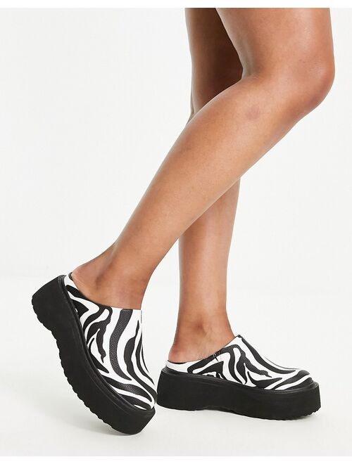 ASOS DESIGN Wide Fit Milo chunky flat mules in zebra