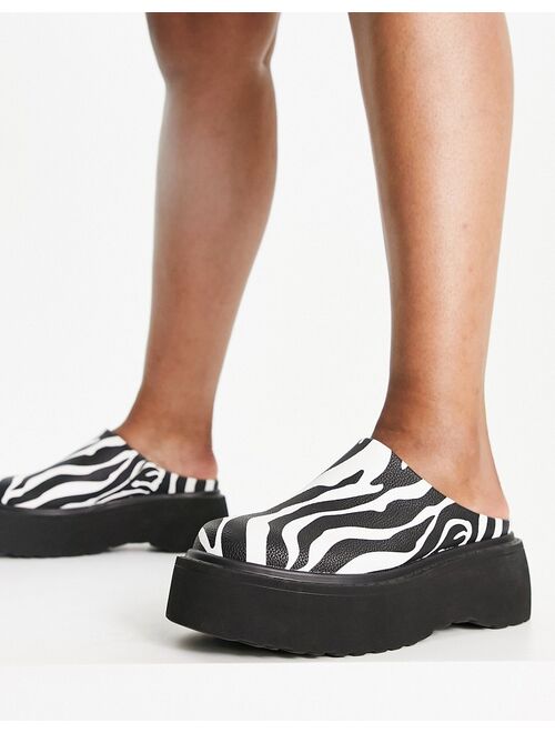 ASOS DESIGN Wide Fit Milo chunky flat mules in zebra