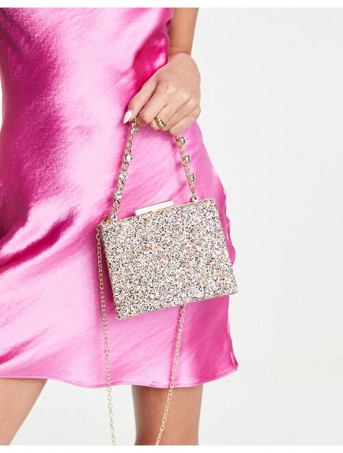 True Decadence clutch bag in pink glitter with chunky chain grab handle