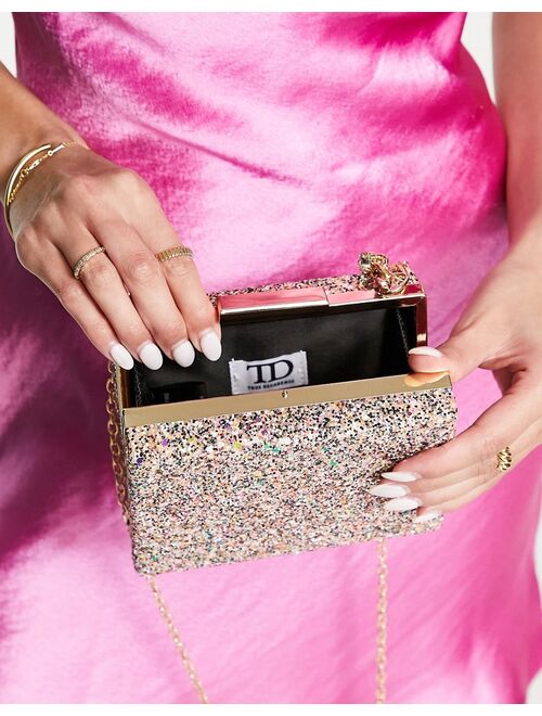 True Decadence clutch bag in pink glitter with chunky chain grab handle