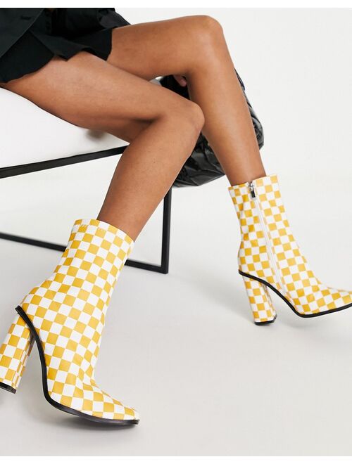 RAID Saylor block heel sock boot in orange checkerboard