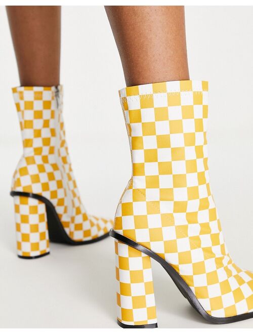 RAID Saylor block heel sock boot in orange checkerboard