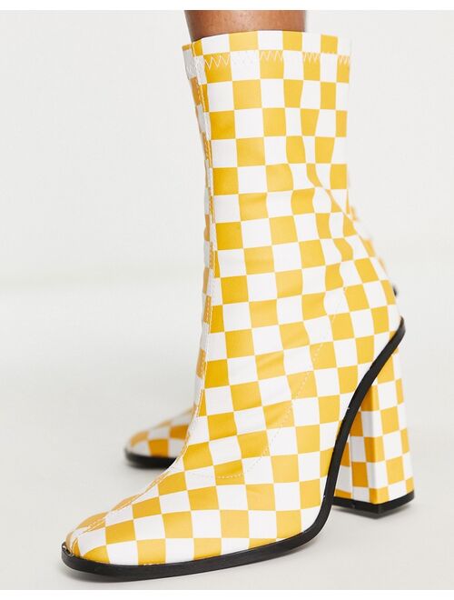 RAID Saylor block heel sock boot in orange checkerboard