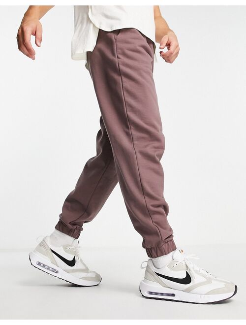 ASOS DESIGN oversized sweatpants in washed brown