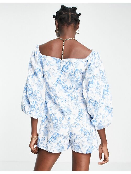 River Island floral puff sleeve romper in light blue