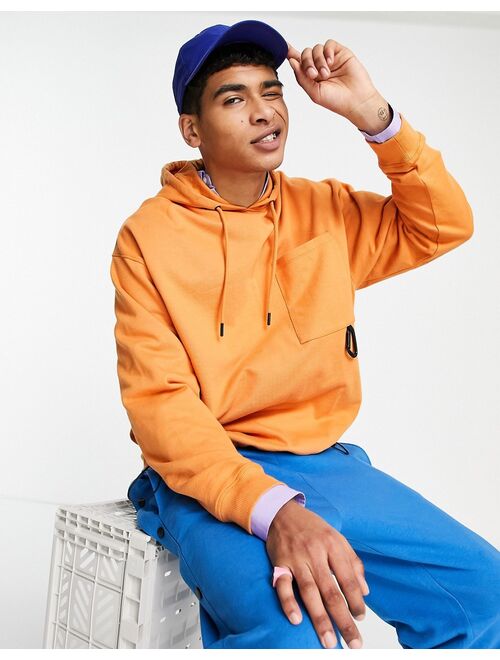 ASOS DESIGN oversized hoodie with toggle details in orange