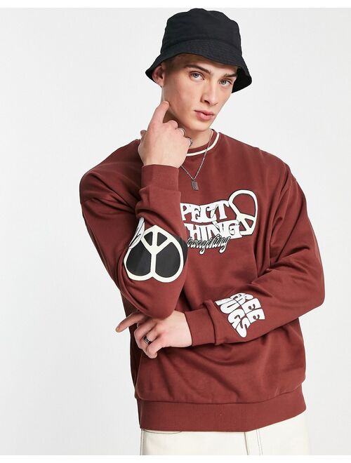 ASOS DESIGN oversized sweatshirt in brown with text prints