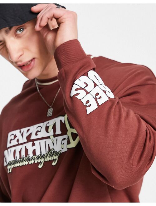 ASOS DESIGN oversized sweatshirt in brown with text prints