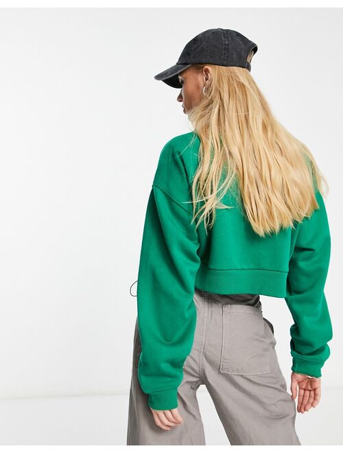 Bershka slogan cropped sweatshirt in green