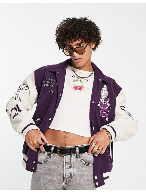 ASOS DESIGN oversized varsity bomber jacket in purple