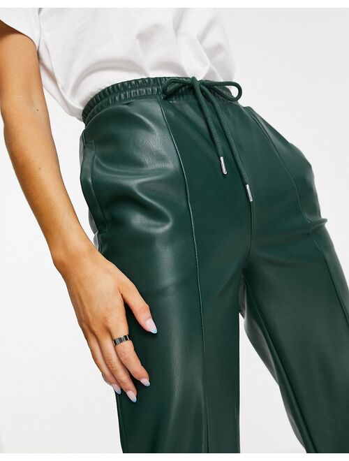 ASOS DESIGN faux leather pants in dark green