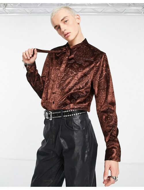 ASOS DESIGN paisley embossed velvet shirt with tie neck in brown