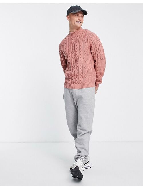 ASOS DESIGN heavyweight cable knit turtle neck sweater in light pink