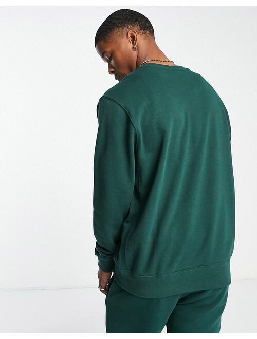 Nike Athletic Club retro logo crew neck sweatshirt in dark green