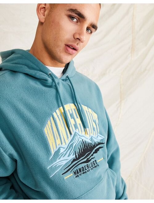 ASOS DESIGN oversized hoodie in blue polar fleece with city embroidery