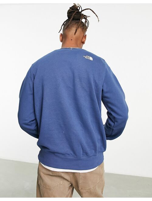 The North Face Graphic Injection chest print sweatshirt in blue