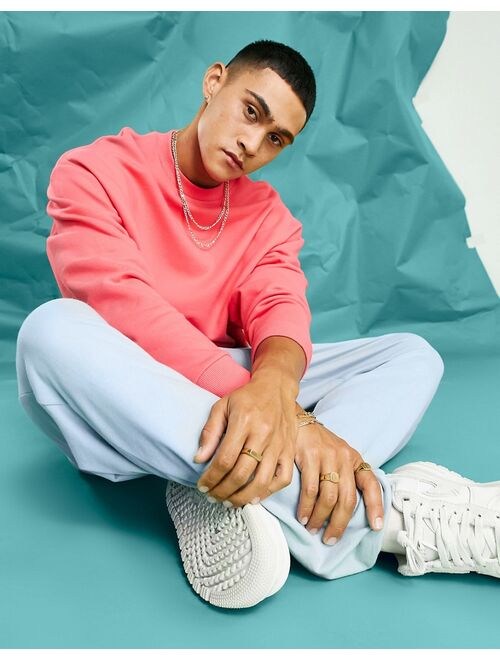 ASOS DESIGN oversized sweatshirt in pink