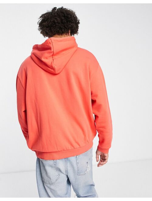 ASOS DESIGN ASOS Unrvlld Spply oversized hoodie with large face graphic front print and logo in red