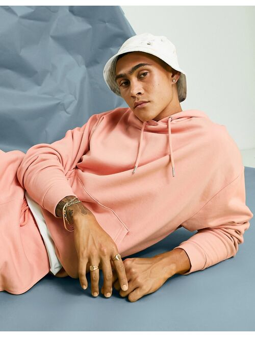 ASOS DESIGN oversized hoodie in pastel orange