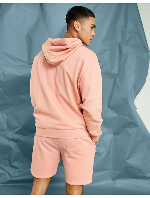 ASOS DESIGN oversized hoodie in pastel orange