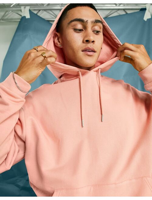 ASOS DESIGN oversized hoodie in pastel orange