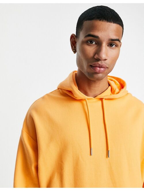 ASOS DESIGN oversized hoodie in pastel orange