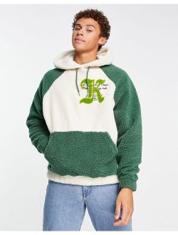oversized borg hoodie in green color block with varsity badge