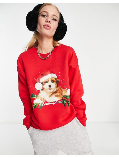 ASOS DESIGN Christmas oversized sweatshirt with santa paws print in bright red