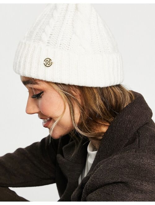 River Island cable knit pom pom beanie in cream