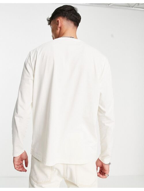 ASOS DESIGN relaxed long sleeve t-shirt in off white with collegiate front print