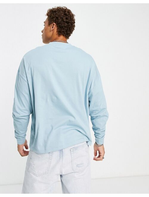 ASOS DESIGN oversized long sleeve t-shirt in blue with city embroidery