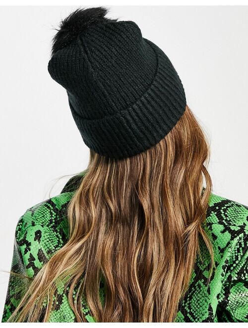 ASOS DESIGN rib knit pom beanie with label detail in black