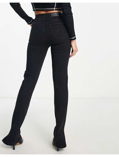 Bershka Petite split hem flared jeans in black