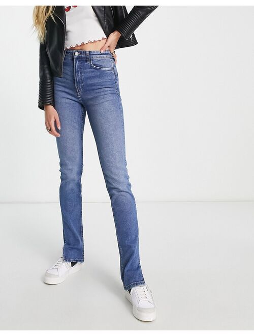 Bershka Tall split hem flare jean in mid blue