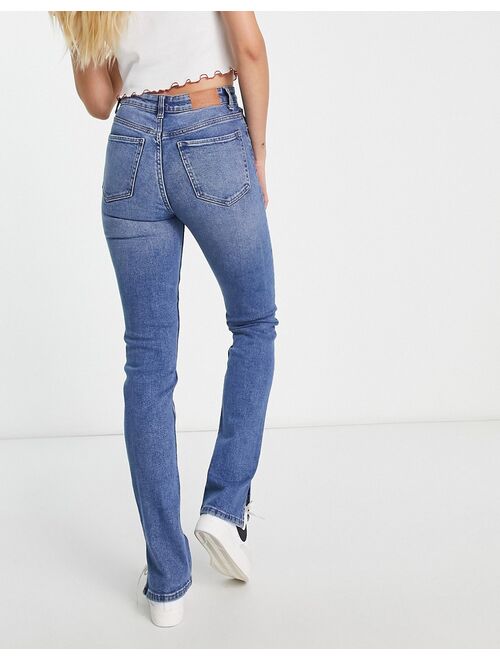 Bershka Tall split hem flare jean in mid blue